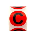 Маркировка электрических шин. Диаметр 20мм, круг. Цвет - красный, символ - "С" черного цвета. Упа ковка - 500 шт.